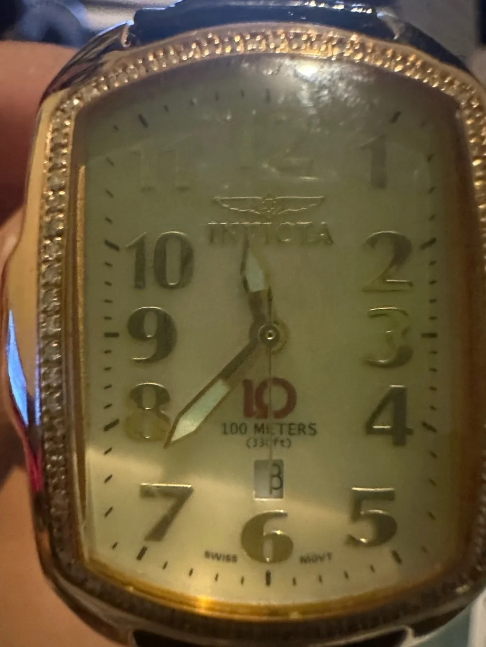 Invicta Women’s Gold-Tone Diamond Accent Watch with White Dial and Brown Strap.